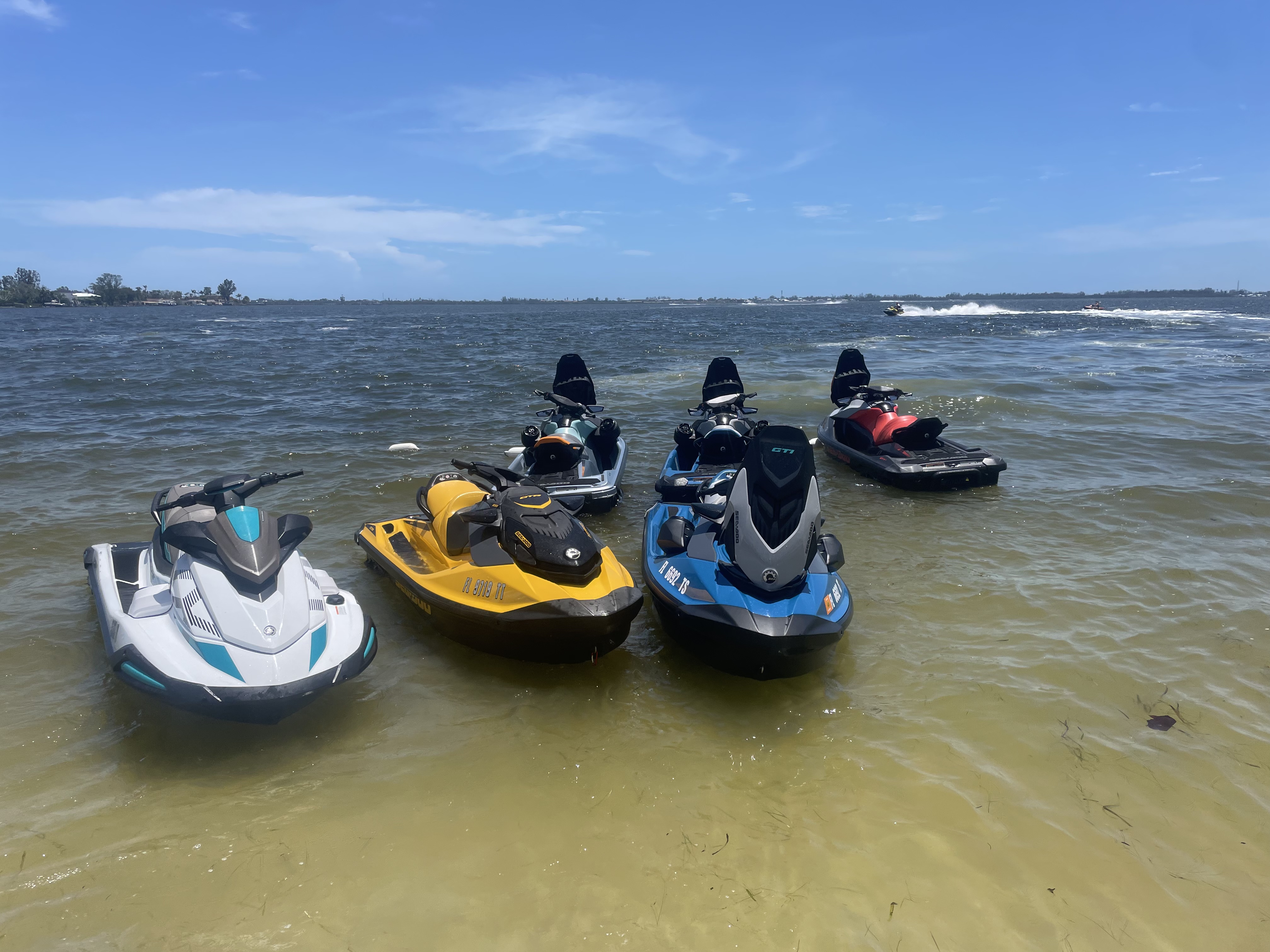 Jet skis ready to ride on the water near Sarasota